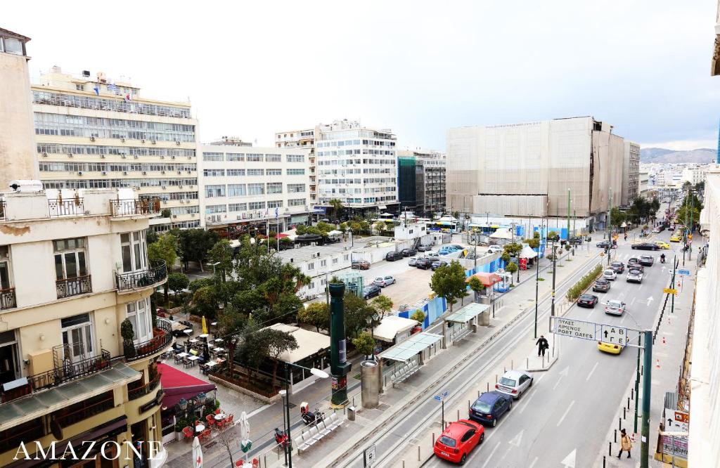 Nespecifikovaný výhled na destinaci Pireus nebo výhled na město při pohledu z apartmánu