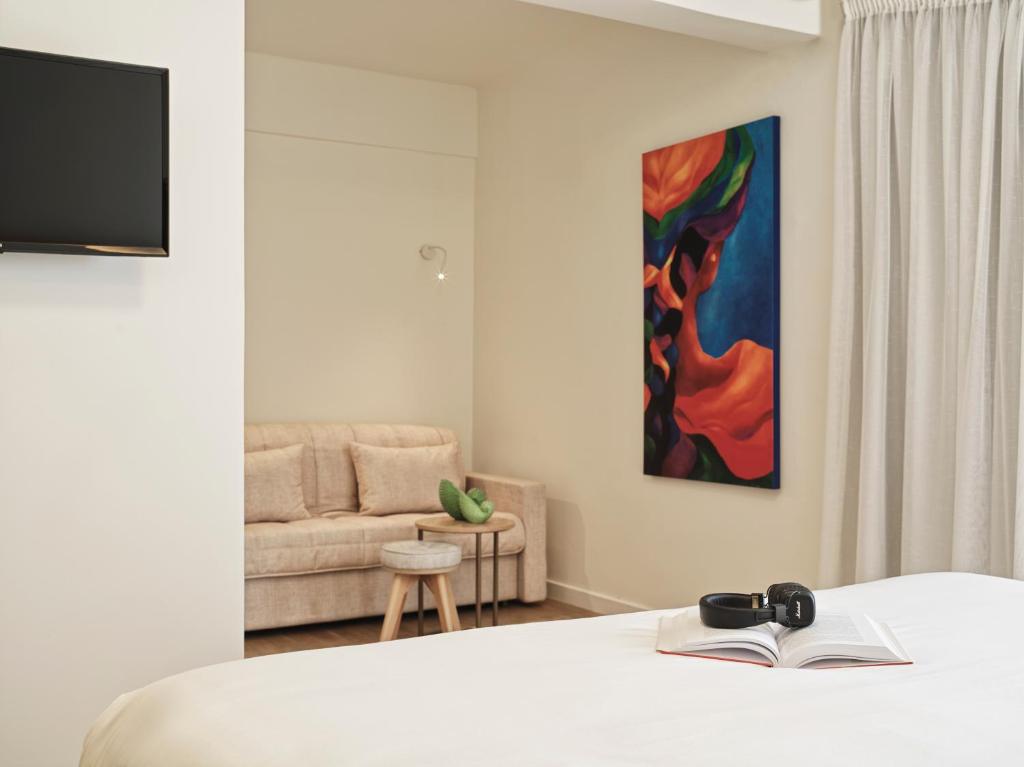 Postel nebo postele na pokoji v ubytování NLH Mati Seafront - Neighborhood Lifestyle Hotels