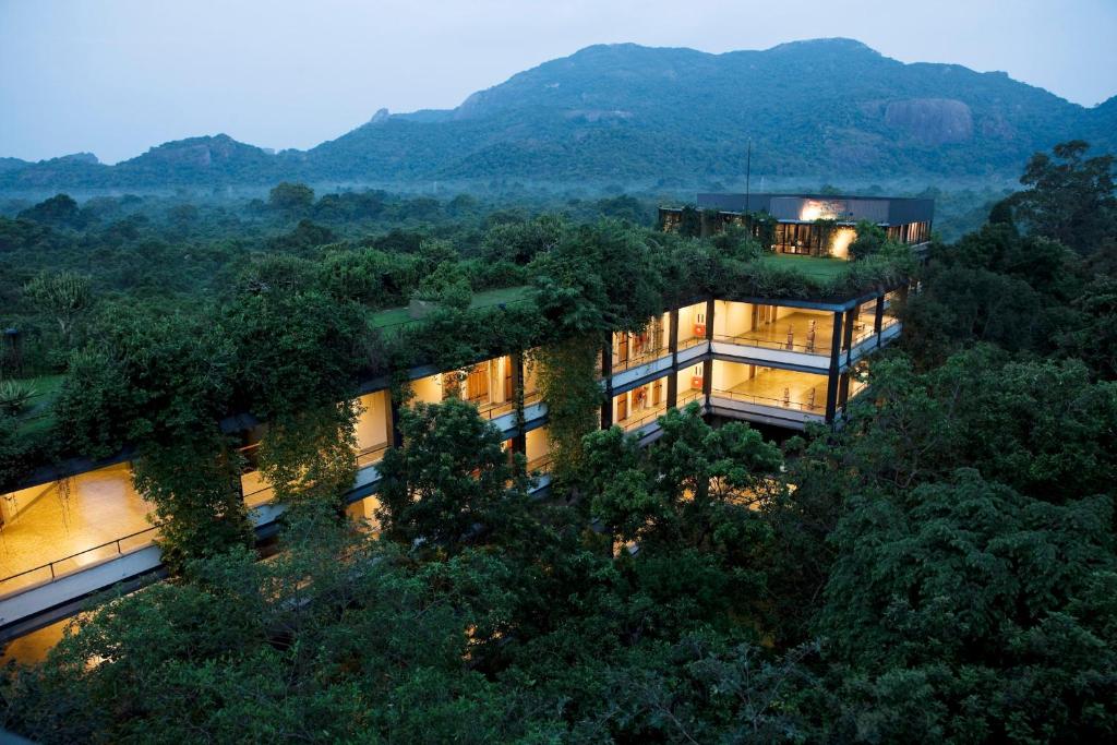 an aerial view of a building with trees at Heritance Kandalama in Sigiriya