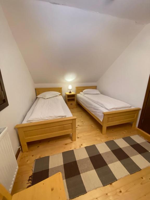 Ліжко або ліжка в номері Szálka Kulcsosház