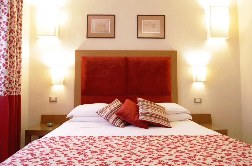 Postel nebo postele na pokoji v ubytování Hotel Perseo