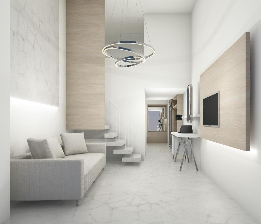 TV a/nebo společenská místnost v ubytování Rihios Hotel