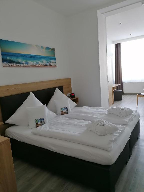 Postel nebo postele na pokoji v ubytování Nordsee Hotel Borkum