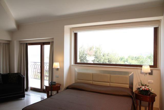 Postel nebo postele na pokoji v ubytování Hotel Palace 4S