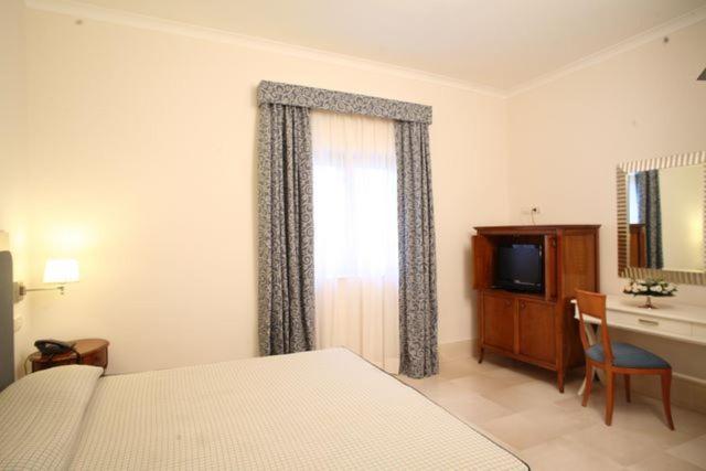 Postel nebo postele na pokoji v ubytování Hotel Palace 4S