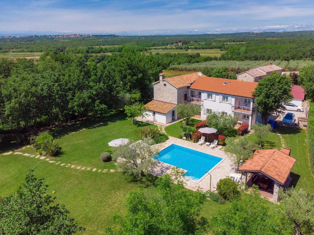 an aerial view of a house with a swimming pool at Holiday Home Tommy by Interhome in Gedići