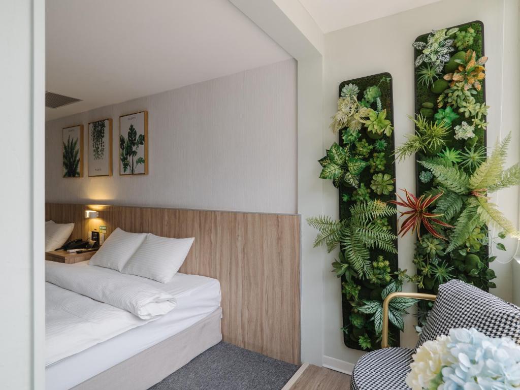Postel nebo postele na pokoji v ubytování Hotel attic