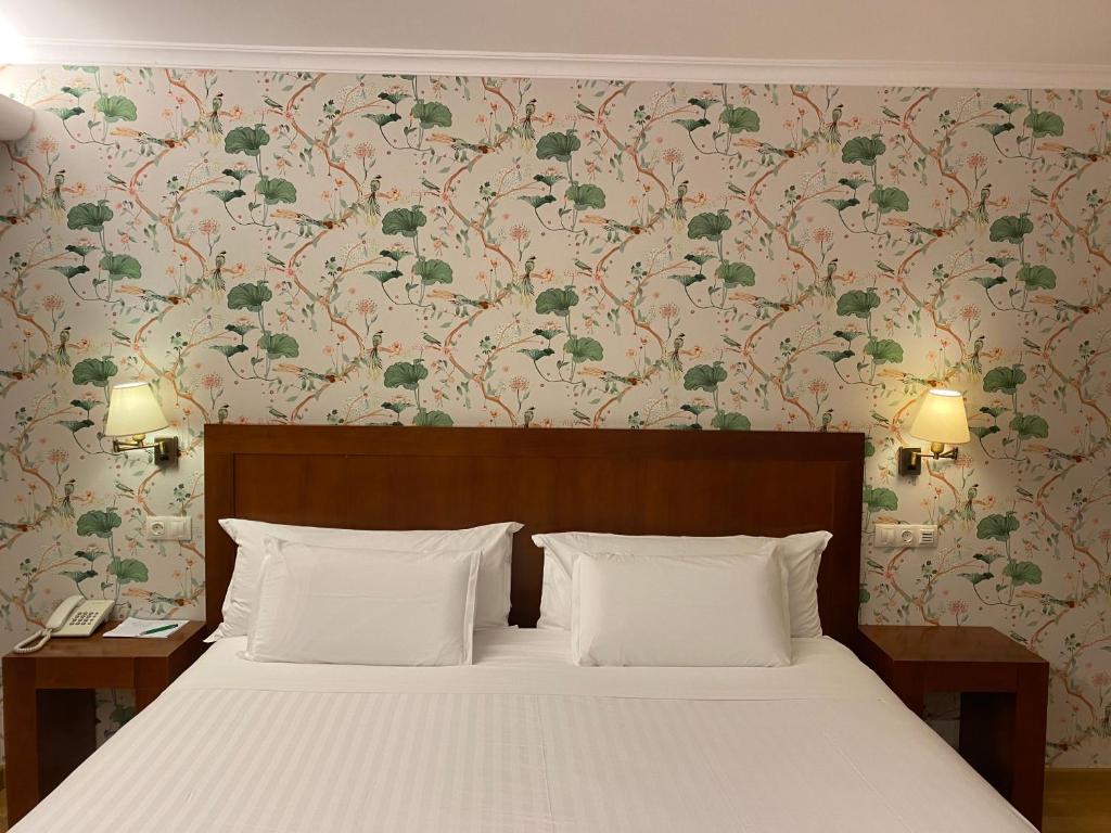 Postel nebo postele na pokoji v ubytování Hotel O Cabazo