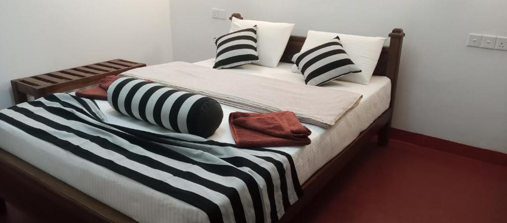 Postel nebo postele na pokoji v ubytování Nethanya Homestay