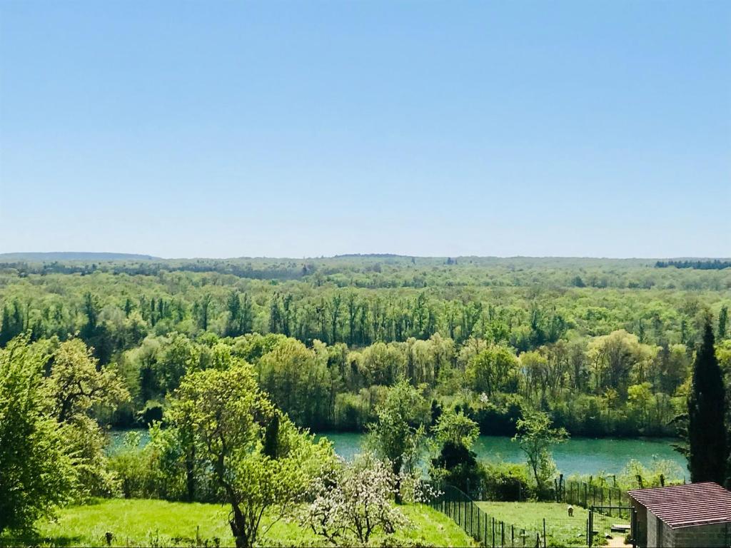 a view of a river from a house at résidence belle vue in Fontaine-le-Port
