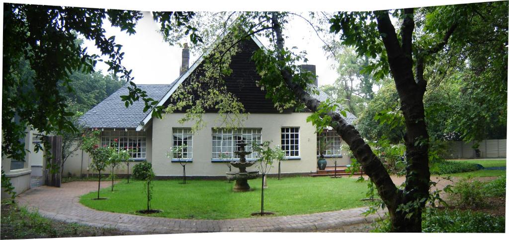 a house with a garden in front of it at Bordeaux Haven Guest House in Vereeniging