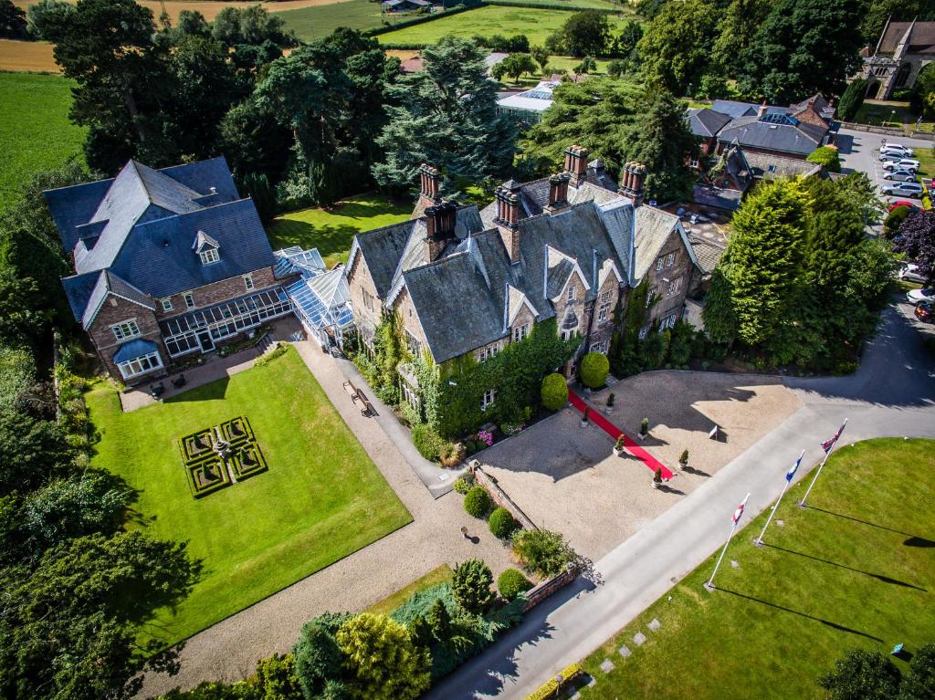 an aerial view of a large house with a yard at The Parsonage Hotel & Spa in Escrick