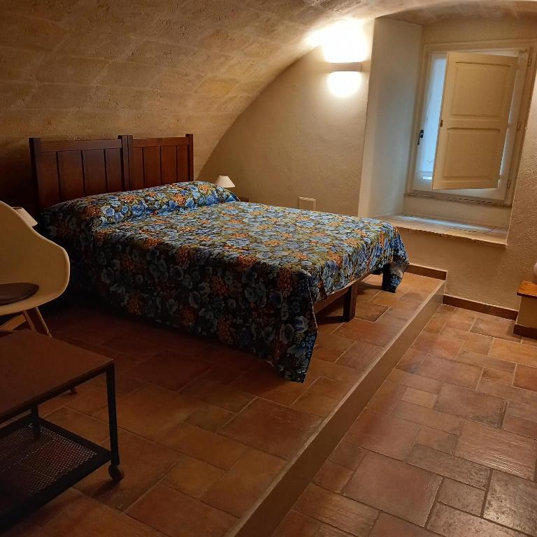 Postel nebo postele na pokoji v ubytování La Cisterna del Vicinato