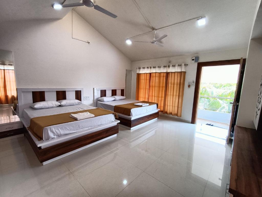 En eller flere senge i et værelse på Green Paradise Trimbak