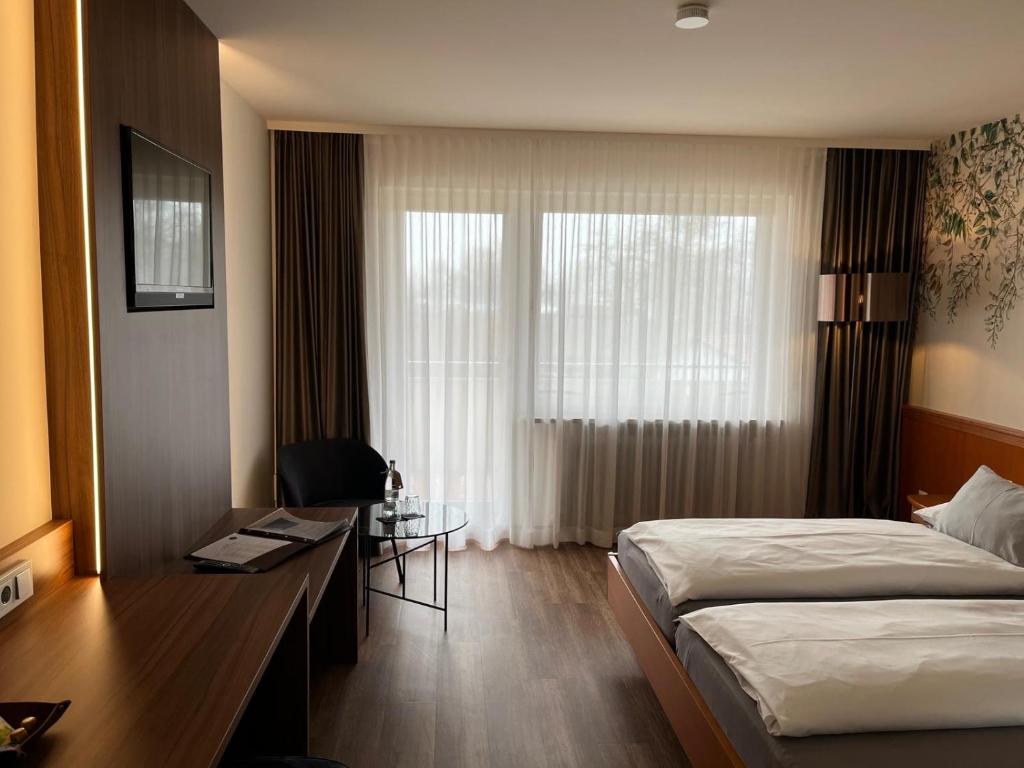 Postel nebo postele na pokoji v ubytování Hotel Gästehaus Zürn