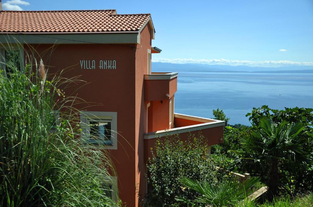 a building with the view of the water at Apartments Villa Anka in Opatija