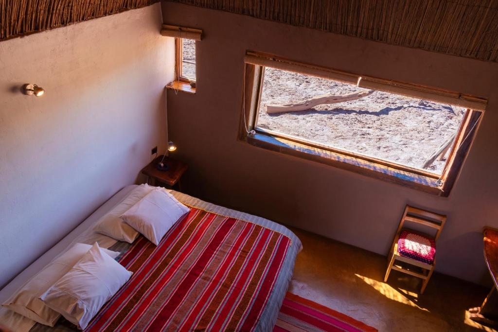 Postel nebo postele na pokoji v ubytování Planeta Atacama Lodge