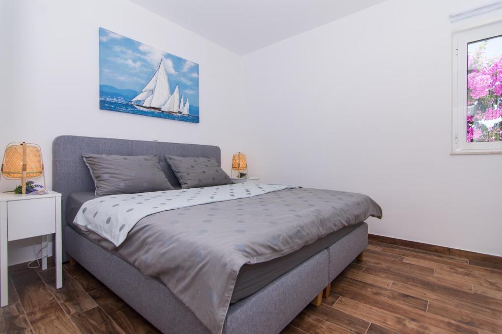 Posteľ alebo postele v izbe v ubytovaní Apartments Lumini