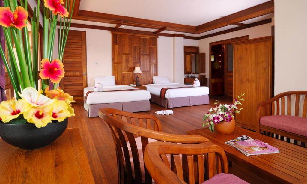 Postel nebo postele na pokoji v ubytování Andamania Beach Resort, Khaolak - SHA plus