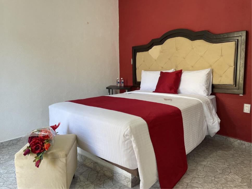 Postel nebo postele na pokoji v ubytování Hotel Peña Florencia