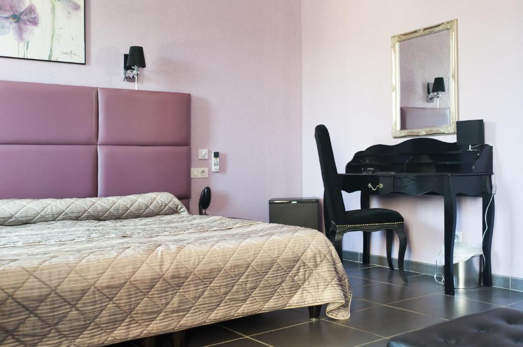 Postel nebo postele na pokoji v ubytování Splendid Hôtel