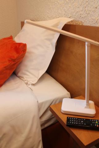 Postel nebo postele na pokoji v ubytování Logis Hotel Beaudon