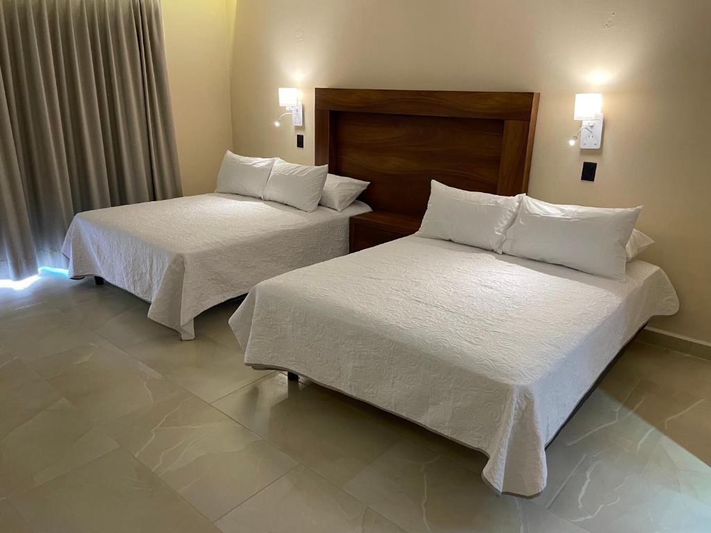 Postel nebo postele na pokoji v ubytování Hotel Balcón del Cielo