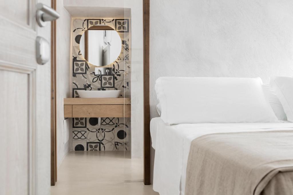 Postel nebo postele na pokoji v ubytování Palazzo Sant'Anna Lecce