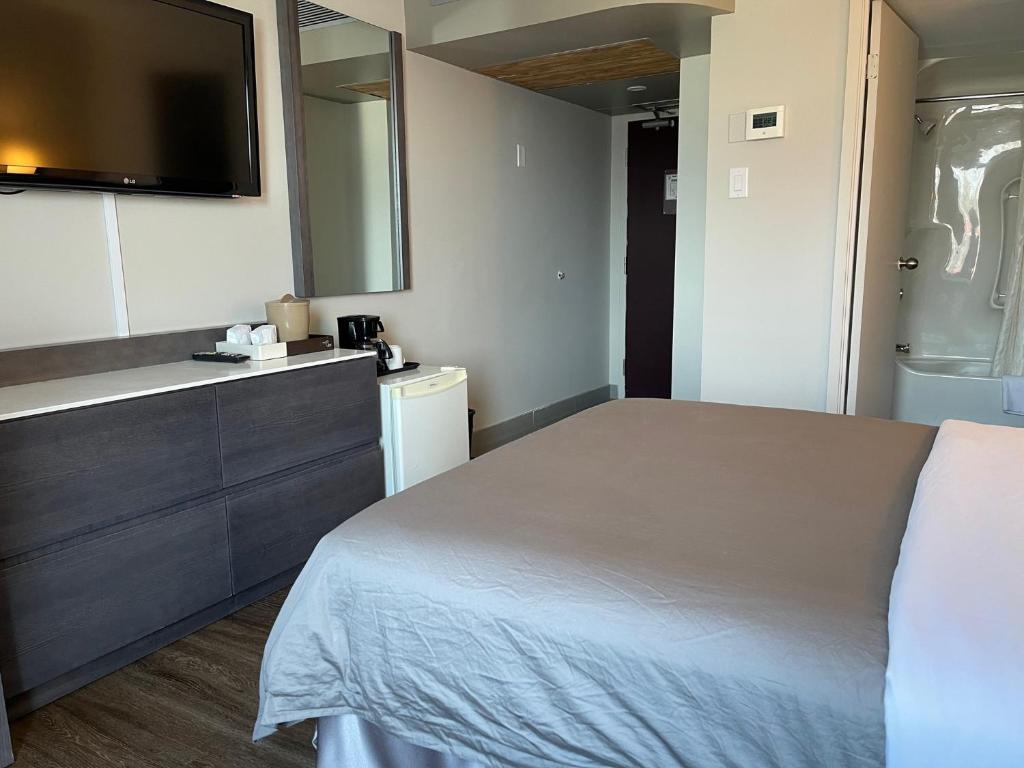 Postel nebo postele na pokoji v ubytování Auberge de la Gare
