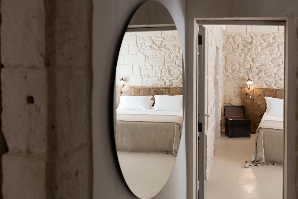 Postel nebo postele na pokoji v ubytování Palazzo Sant'Anna Lecce