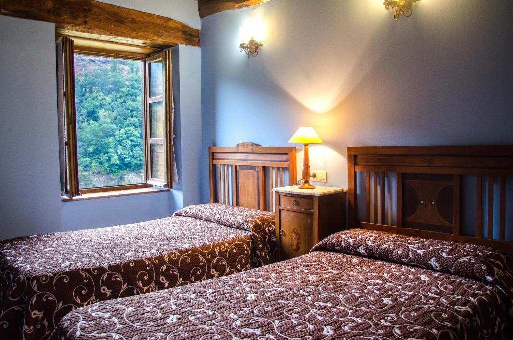 Postel nebo postele na pokoji v ubytování Casas Rurales Taramundi Verde