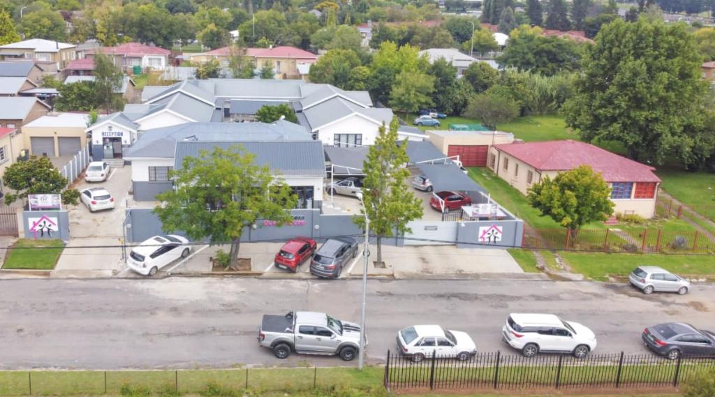 an aerial view of a parking lot with cars parked at The Daughters Guest House in Bethlehem