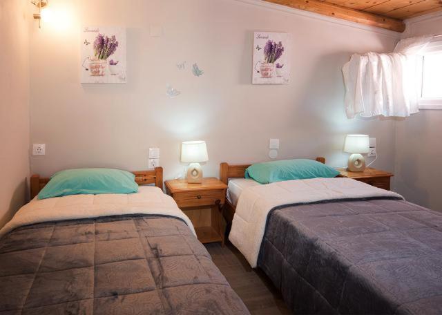 Postel nebo postele na pokoji v ubytování Efi Apartments