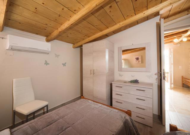 Postel nebo postele na pokoji v ubytování Efi Apartments