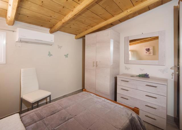 Postel nebo postele na pokoji v ubytování Efi Apartments