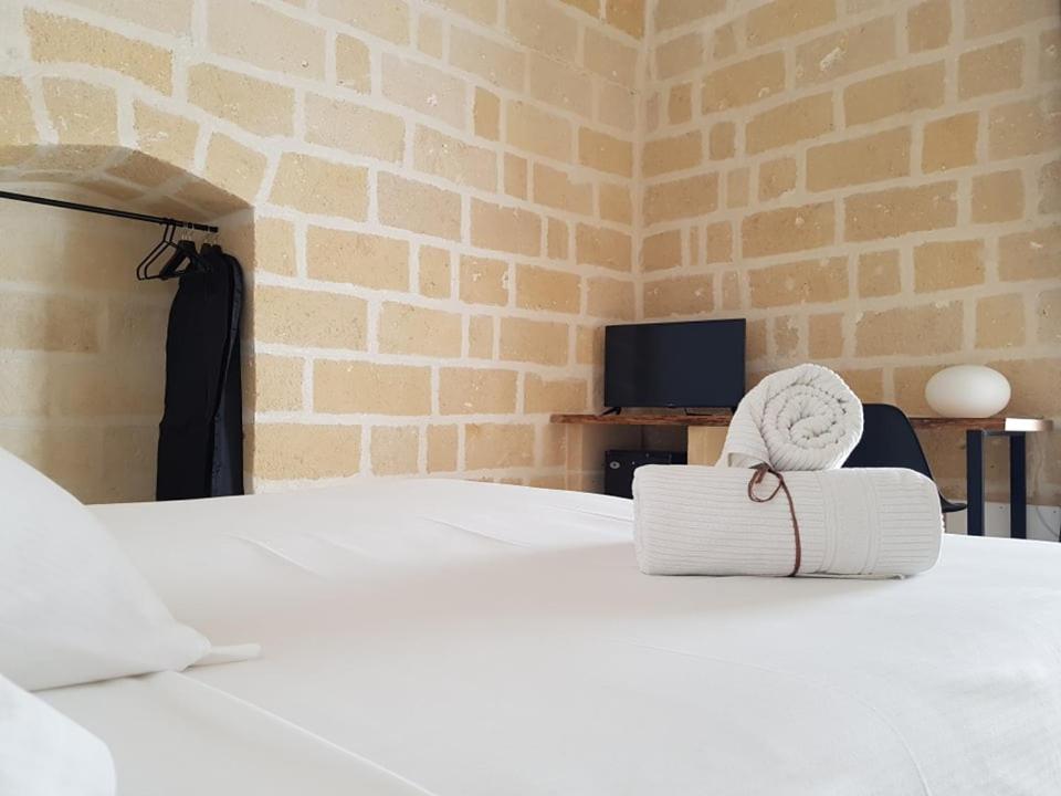 Łóżko lub łóżka w pokoju w obiekcie Residence Masseria Santa Lucia