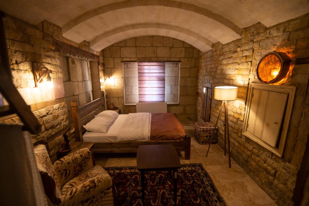 Posteľ alebo postele v izbe v ubytovaní The Cave House