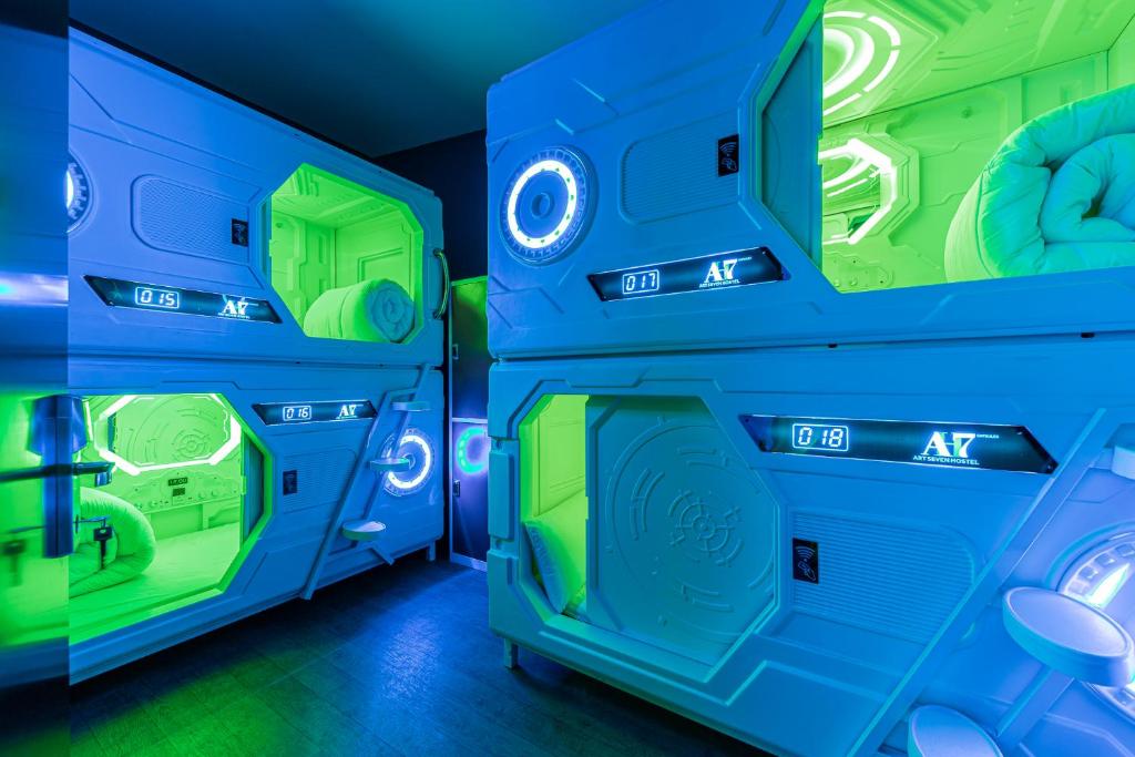 an empty room with blue and green walls at Art Seven Hostel Capsules in Madrid
