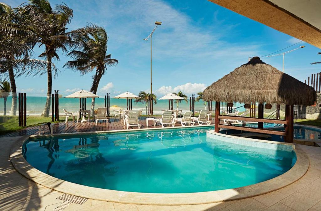 Swimmingpoolen hos eller tæt på Elegance flat Natal RN - PLAC