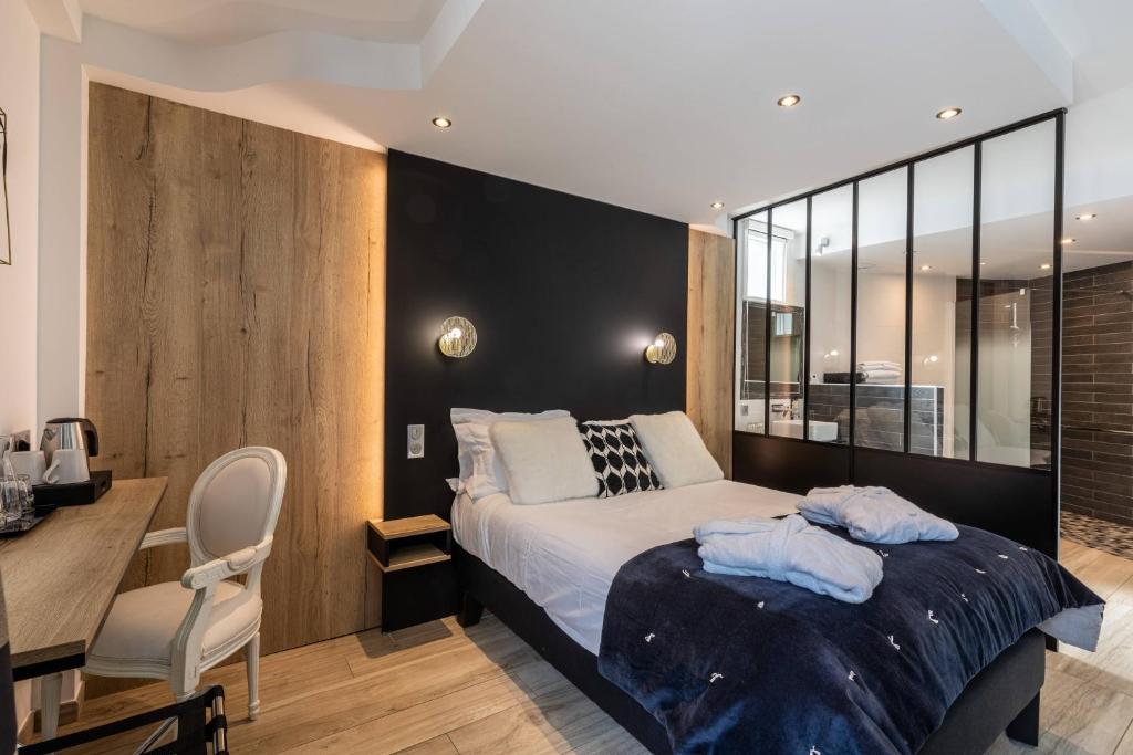 Postel nebo postele na pokoji v ubytování Le Bailliage Hôtel & Spa