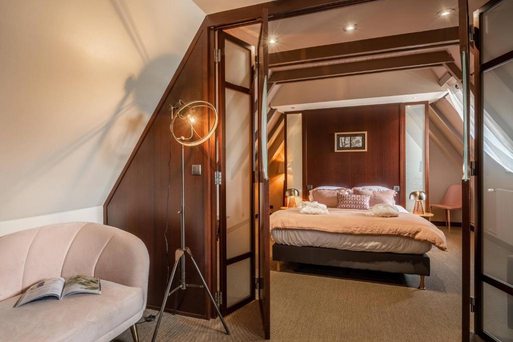 Postel nebo postele na pokoji v ubytování Le Bailliage Hôtel & Spa