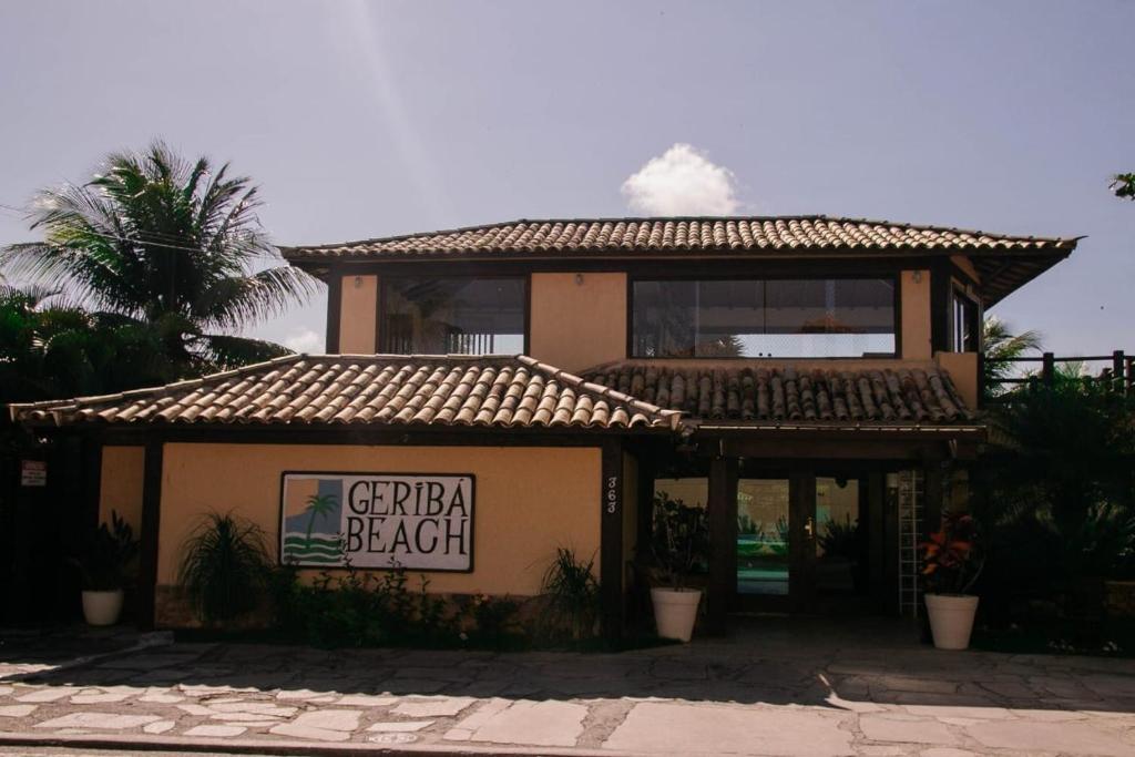 a building with a sign that reads grandpa beach at Geriba Beach apart hotel apt504 in Búzios
