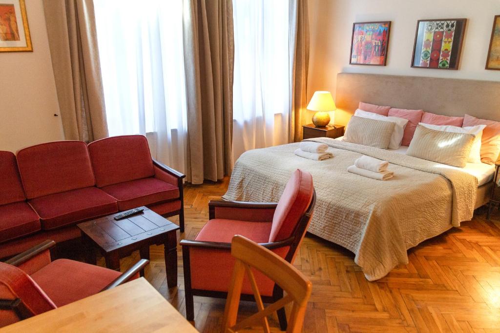 Posteľ alebo postele v izbe v ubytovaní Lounge Apartments