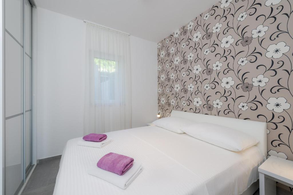 Postel nebo postele na pokoji v ubytování Apartments Lanterna