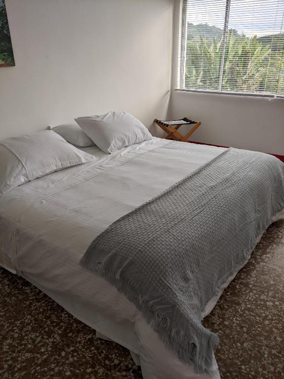Voodi või voodid majutusasutuse Hacienda Guayabal toas