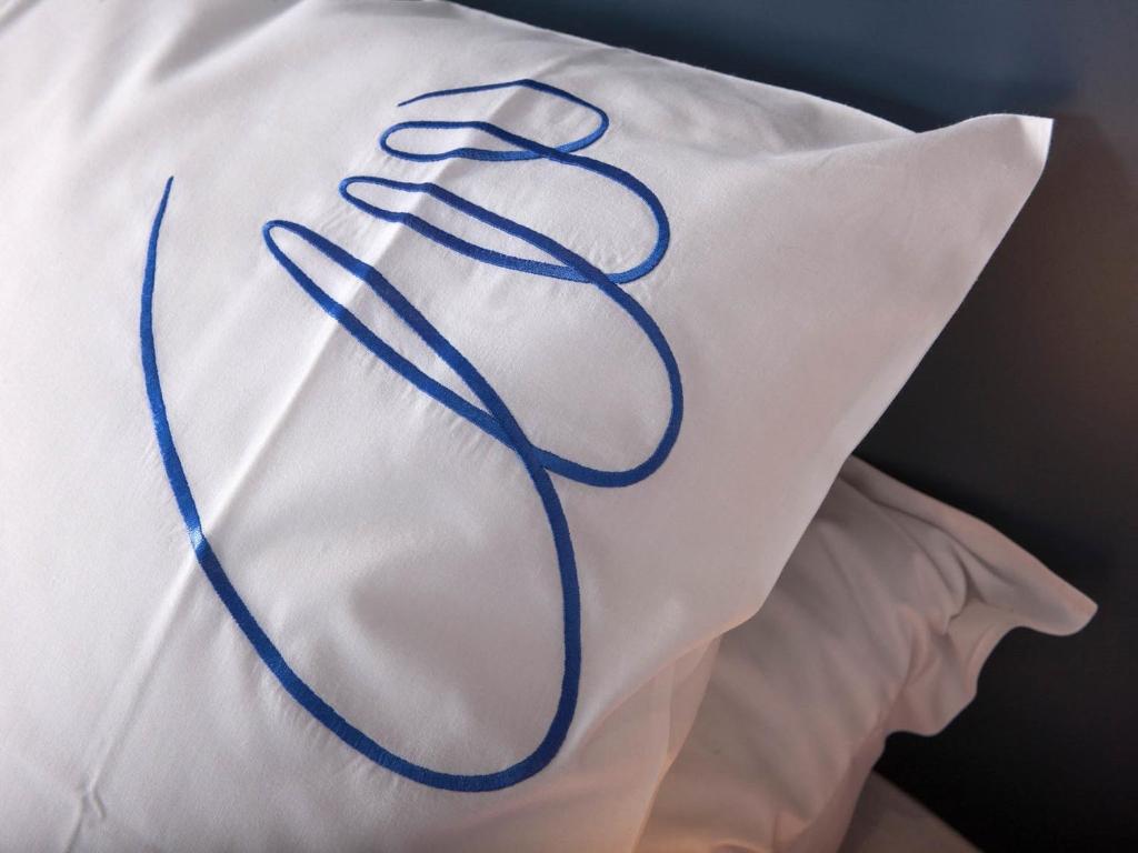 Postel nebo postele na pokoji v ubytování Hotel Gabriel