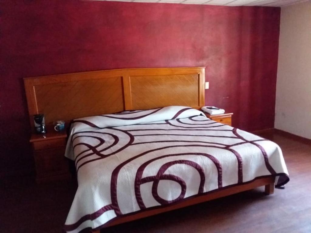 Postel nebo postele na pokoji v ubytování HOTEL RESTAURANT LOS PRISMAS