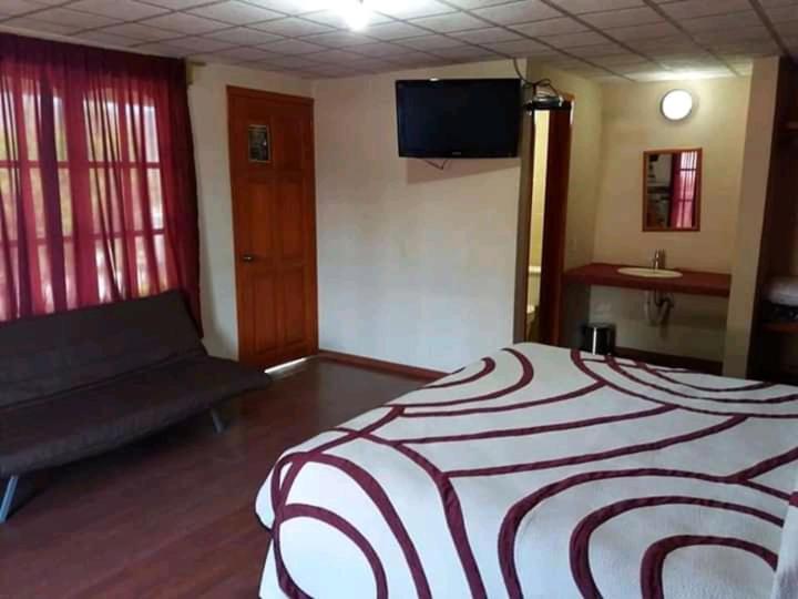 Postel nebo postele na pokoji v ubytování HOTEL RESTAURANT LOS PRISMAS