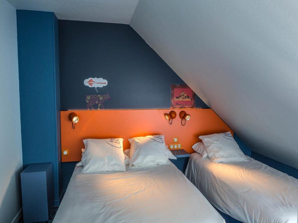 Postel nebo postele na pokoji v ubytování Hotel Gabriel