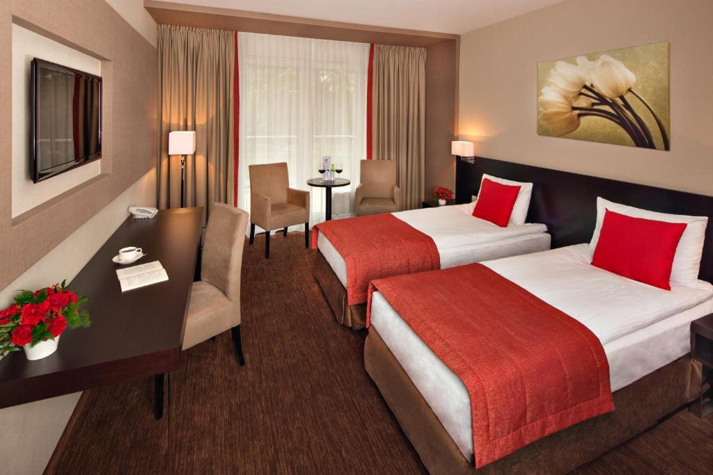 Postel nebo postele na pokoji v ubytování Z-Hotel Business & Spa